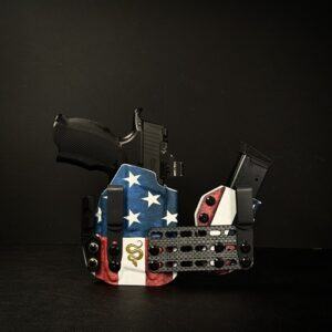 Patriotic gun holster with a black handgun showing above it.